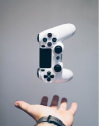 controller suspended in air over an open hand